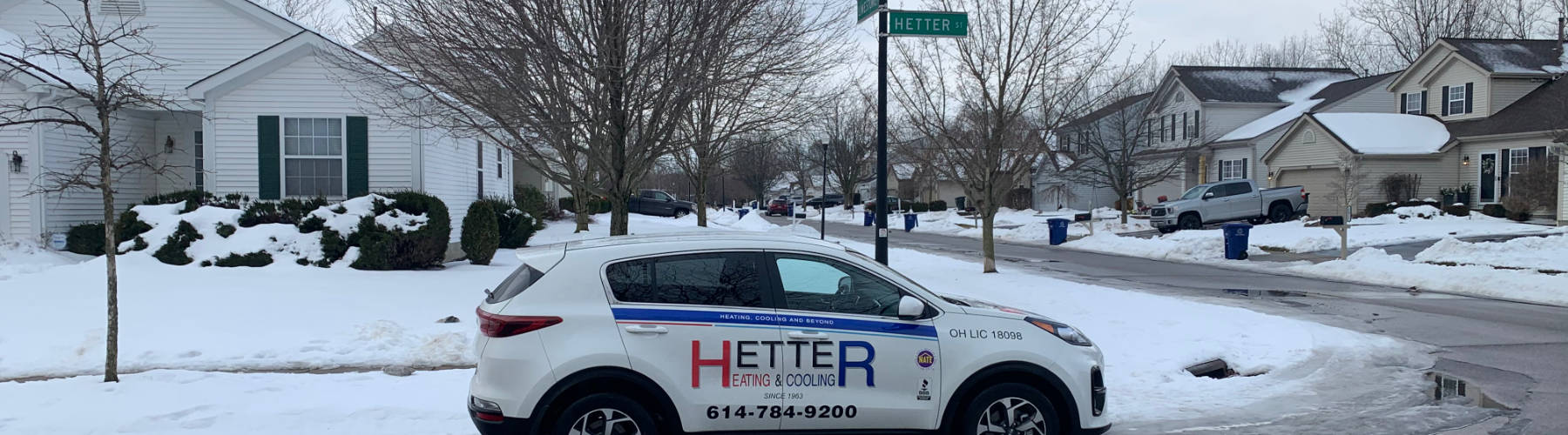 Picture of Hetter Heating vehicle on street in winter